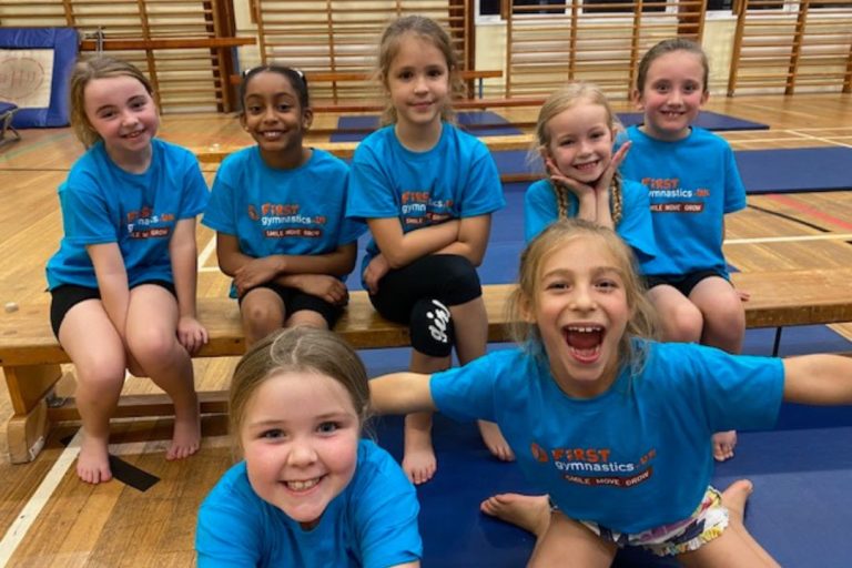 Big smiles from the kids at First Gymnastics children's sports and gymnastics franchise