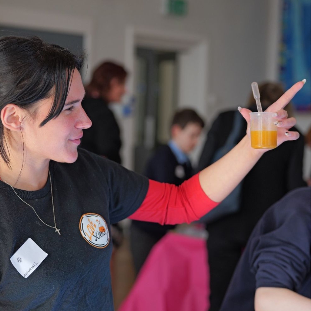 A teacher at LoveScience shares a science experiment with children as part of the LoveScience children's STEM franchise offering