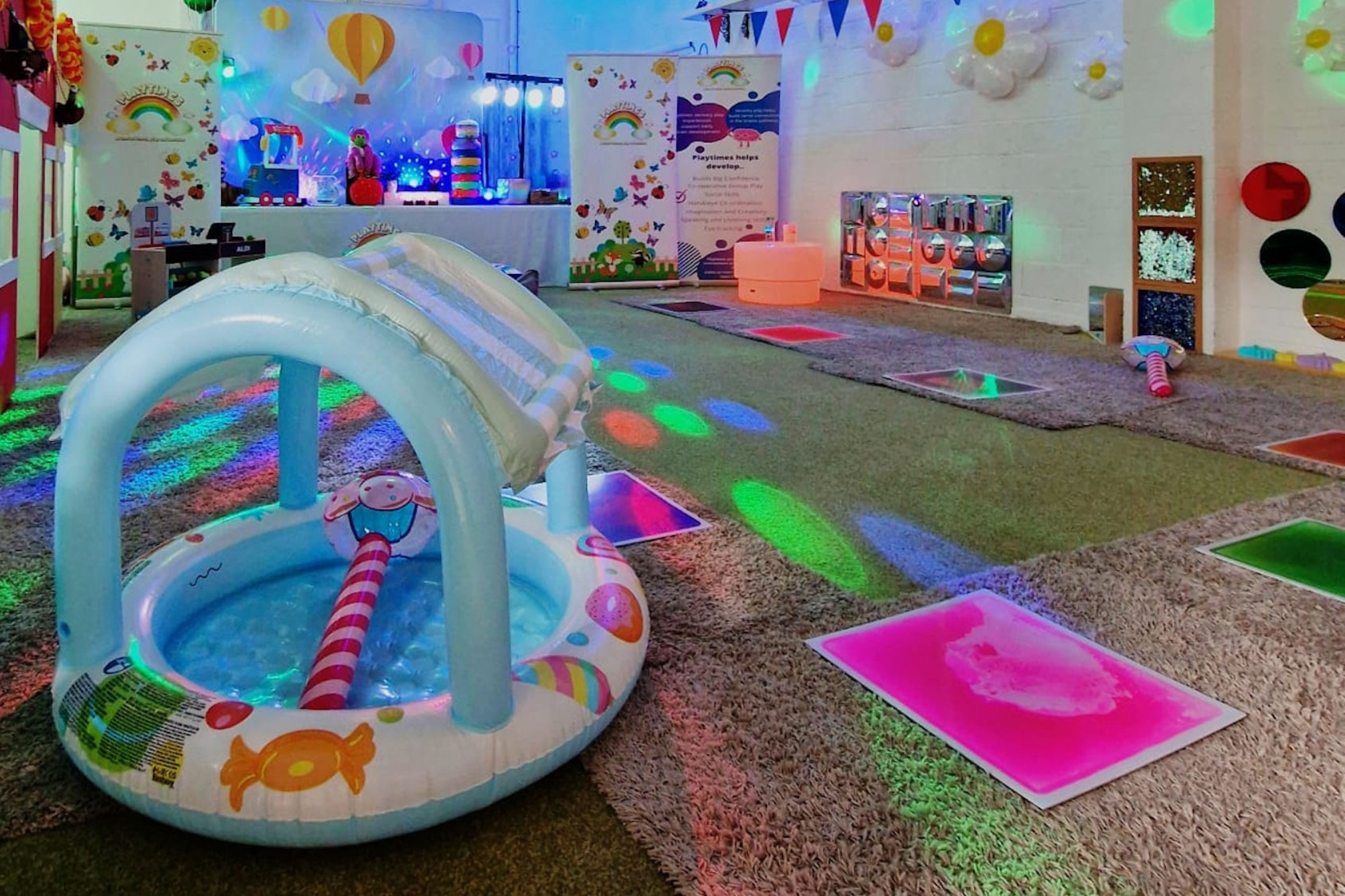 The exciting sensory experience of a session at Playtimes sensory franchise is set out in an inviting, colourful space filled with lights and props ready for the children