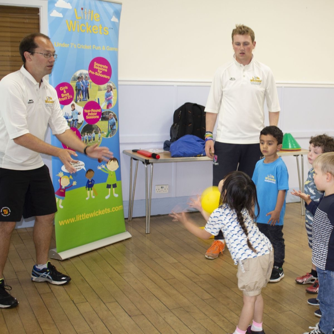 The coaches from children's sports franchise Little Wickets play an indoor ball game with a group of young children